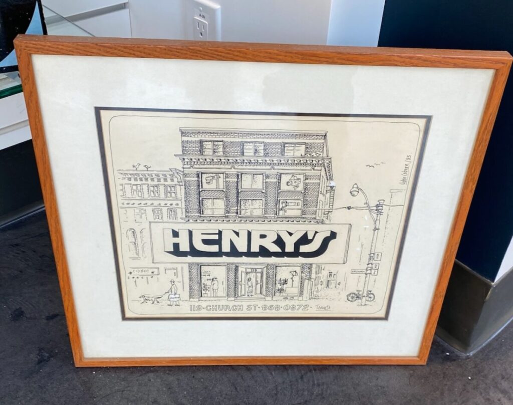 Image of a framed blueprint of Henry's former flagship and head office on 119 Church Street in Toronto, Ontario. 